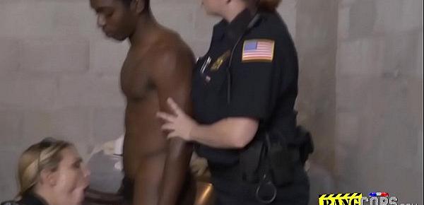  Black thug is fucking with two slutty female cops in jail.